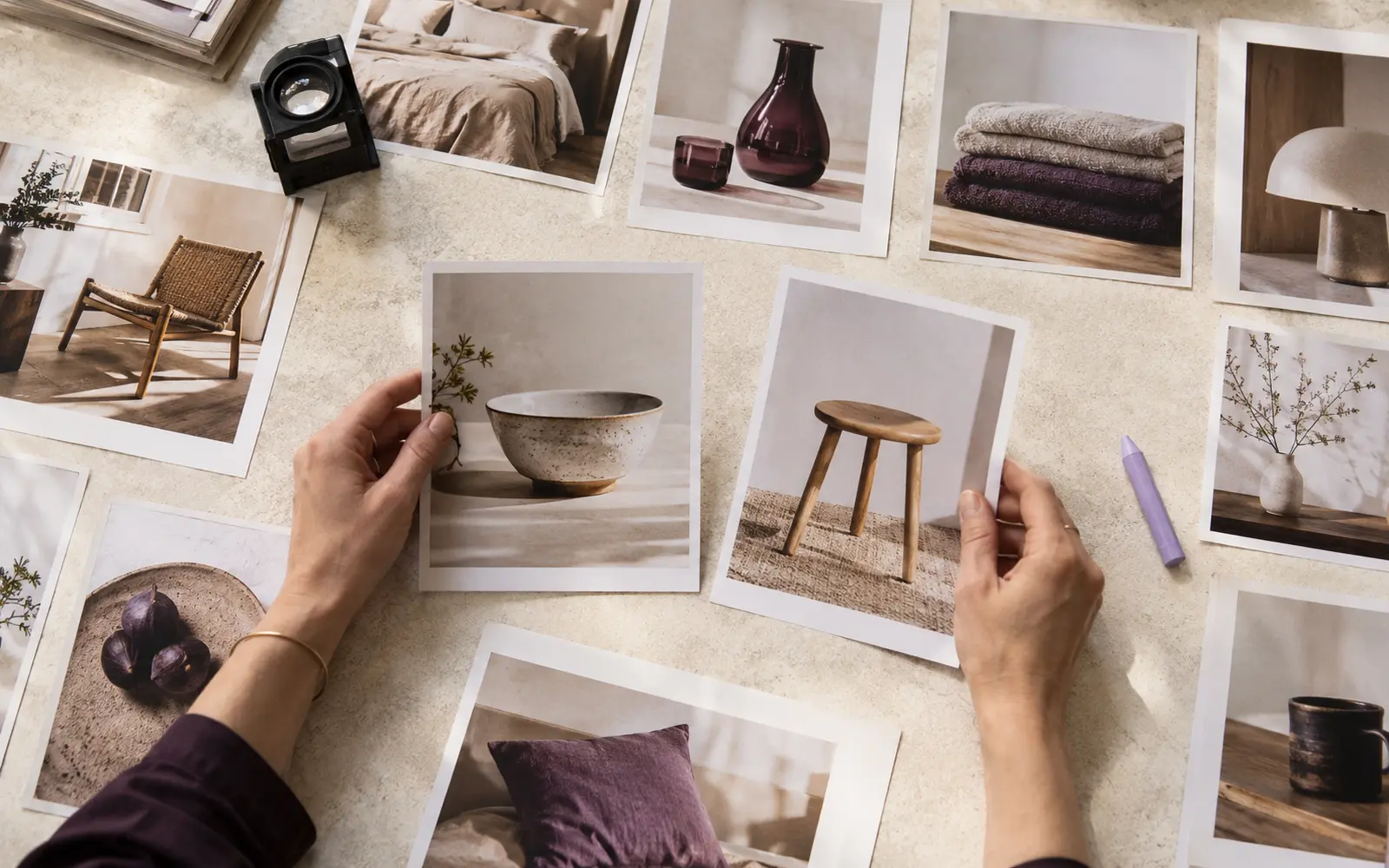 Product photos laid out on a table for selection